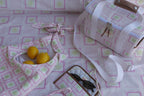 ZAZZA Pink Cooler Bag styled with picnic collection, a pair of sunglasses and lemons 