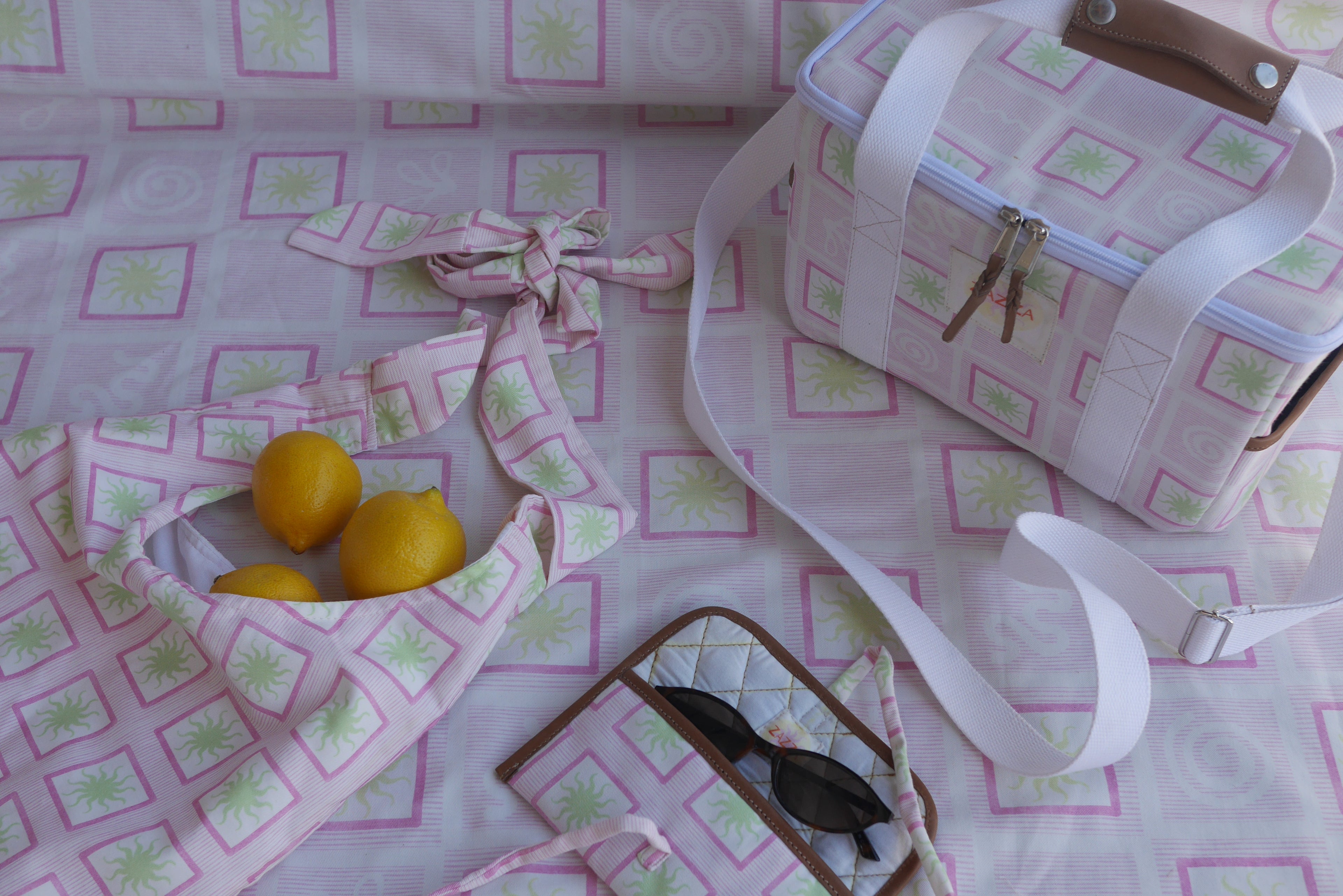 ZAZZA pink picnic collection, styled with lemons & a pair of sunglasses